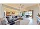 Spacious living room, open floor plan with access to backyard patio at 11411 Drifting Leaf Dr, Riverview, FL 33579