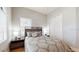 Well-lit bedroom with wood floors and a ceiling fan at 11411 Drifting Leaf Dr, Riverview, FL 33579