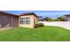 Spacious grassy backyard with screened patio and privacy fence at 11411 Drifting Leaf Dr, Riverview, FL 33579