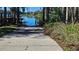Concrete boat ramp extending to the water's edge, a perfect place for a day on the lake at 1817 Hammocks Ave # 1817, Lutz, FL 33549