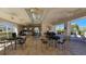 Spacious clubhouse with ample seating, ceiling fans, and serene views of the outdoors at 1817 Hammocks Ave # 1817, Lutz, FL 33549