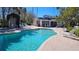 Inviting pool and hot tub area near the clubhouse, surrounded by lounge chairs for residents at 1817 Hammocks Ave # 1817, Lutz, FL 33549
