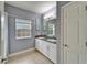 Spacious bathroom with dual sinks, granite countertops, and ample cabinet storage at 19300 Lonesome Pine Dr, Land O Lakes, FL 34638