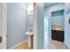 This is a pedestal sink in a bright and modern powder room at 19300 Lonesome Pine Dr, Land O Lakes, FL 34638