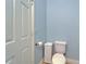 A neat and tidy bathroom featuring a toilet and decorative storage piece at 19300 Lonesome Pine Dr, Land O Lakes, FL 34638