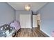 This bedroom features wood floors, large closet, chandelier, and decor at 19300 Lonesome Pine Dr, Land O Lakes, FL 34638