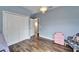 This bedroom features wood floors, a large closet, and decor at 19300 Lonesome Pine Dr, Land O Lakes, FL 34638