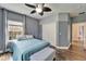 Bedroom featuring wood-look tile floors, and a built-in closet at 19300 Lonesome Pine Dr, Land O Lakes, FL 34638
