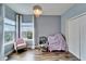 Bright bedroom featuring a chandelier, and a double window for natural light at 19300 Lonesome Pine Dr, Land O Lakes, FL 34638