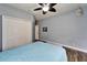 Bedroom showcasing a ceiling fan and natural light with access to the hallway at 19300 Lonesome Pine Dr, Land O Lakes, FL 34638