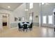 Elegant dining room with soaring ceilings, large windows, and stylish decor at 19300 Lonesome Pine Dr, Land O Lakes, FL 34638