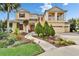 Inviting two-story house features lush landscaping, a charming walkway, and a convenient two-car garage at 19300 Lonesome Pine Dr, Land O Lakes, FL 34638