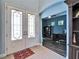 Inviting foyer with double doors and sidelights, tile flooring and a glimpse of the office at 19300 Lonesome Pine Dr, Land O Lakes, FL 34638