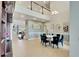 Spacious foyer featuring a high ceiling, staircase, dining room, and tile flooring at 19300 Lonesome Pine Dr, Land O Lakes, FL 34638