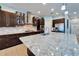 Close up of an island, modern stainless appliances, and beautiful countertops in the spacious kitchen at 19300 Lonesome Pine Dr, Land O Lakes, FL 34638