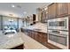 Modern kitchen boasts granite counters, stainless steel appliances, and ample cabinet space at 19300 Lonesome Pine Dr, Land O Lakes, FL 34638
