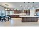 Spacious open kitchen with granite counters, stainless steel appliances, and ample cabinet space at 19300 Lonesome Pine Dr, Land O Lakes, FL 34638