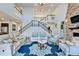 Large living room with high ceilings, a fireplace, and an open floor plan at 19300 Lonesome Pine Dr, Land O Lakes, FL 34638