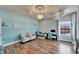 A bright living room with a desk area, beautiful decor, and plenty of natural light at 19300 Lonesome Pine Dr, Land O Lakes, FL 34638