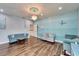 A large living room with blue walls, stylish furniture, and ample space for entertaining at 19300 Lonesome Pine Dr, Land O Lakes, FL 34638