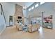 Bright living room featuring a stone fireplace and lots of natural light at 19300 Lonesome Pine Dr, Land O Lakes, FL 34638