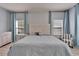 An inviting main bedroom with a detailed headboard, natural light, and tasteful decor at 19300 Lonesome Pine Dr, Land O Lakes, FL 34638