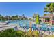 Resort-style pool with lounge chairs and umbrellas at 16903 Peaceful Valley Dr, Wimauma, FL 33598