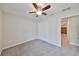 Bedroom featuring a ceiling fan and double door closet at 16903 Peaceful Valley Dr, Wimauma, FL 33598