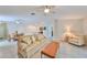Living room with beige sofa and a ceiling fan at 16903 Peaceful Valley Dr, Wimauma, FL 33598