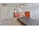 Spacious bedroom with wood furniture and ceiling fan at 16903 Peaceful Valley Dr, Wimauma, FL 33598
