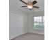 Bedroom with ceiling fan, window, closet, and carpet at 16903 Peaceful Valley Dr, Wimauma, FL 33598