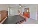 Well-lit bedroom with wood furniture and large window at 16903 Peaceful Valley Dr, Wimauma, FL 33598