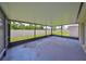 Covered screened patio overlooking backyard at 16903 Peaceful Valley Dr, Wimauma, FL 33598