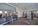 Community fitness center with various exercise equipment and mirrors at 16903 Peaceful Valley Dr, Wimauma, FL 33598