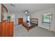 Spacious bedroom with wood furniture and neutral decor at 16903 Peaceful Valley Dr, Wimauma, FL 33598