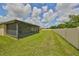 Large backyard with screened patio and fenced perimeter at 16903 Peaceful Valley Dr, Wimauma, FL 33598