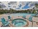 Hot tub and surrounding lounge chairs near pool at 16903 Peaceful Valley Dr, Wimauma, FL 33598