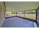 Spacious covered patio with screened enclosure at 16903 Peaceful Valley Dr, Wimauma, FL 33598