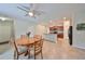 Dining area with a round table and access to kitchen at 16903 Peaceful Valley Dr, Wimauma, FL 33598