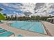 Community pool with lap lanes and plenty of lounge chairs at 16903 Peaceful Valley Dr, Wimauma, FL 33598