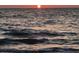 Dark ocean reflecting the setting sun at 100 Bluff View Dr # 605A, Belleair Bluffs, FL 33770