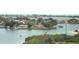 Aerial view of waterfront homes and boats on a sunny day at 100 Bluff View Dr # 605A, Belleair Bluffs, FL 33770