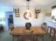 Bright dining room featuring a wood table and unique wall decor at 100 Bluff View Dr # 605A, Belleair Bluffs, FL 33770