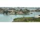 Scenic waterfront view with lush greenery and houses at 100 Bluff View Dr # 605A, Belleair Bluffs, FL 33770