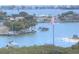 Stunning aerial view of waterfront property with boats and beautiful homes at 100 Bluff View Dr # 605A, Belleair Bluffs, FL 33770