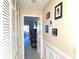 Bright hallway with built-in storage and access to other rooms at 100 Bluff View Dr # 605A, Belleair Bluffs, FL 33770