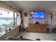Living room with large windows, water views, and coastal decor at 100 Bluff View Dr # 605A, Belleair Bluffs, FL 33770