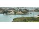 Aerial view of waterfront homes and boats on a sunny day at 100 Bluff View Dr # 605A, Belleair Bluffs, FL 33770