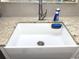 Farmhouse-style sink with a modern faucet and granite countertop at 100 Bluff View Dr # 605A, Belleair Bluffs, FL 33770
