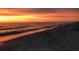 Spectacular sunset casting warm hues over the beach and ocean at 100 Bluff View Dr # 605A, Belleair Bluffs, FL 33770